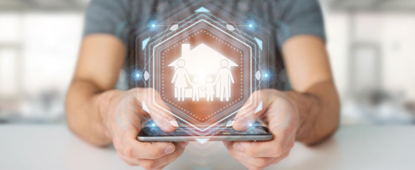 man holding a hologram graphic of a house